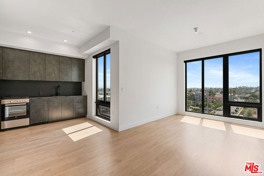 Welcome to Arya. Located in the Palms/Culver City neighborhood. This corner studio floor plan is available the 5th floor, with views facing West. At 490 sf and a full kitchen, you have the space for a living room seating area, small dining table, and bedroom set. Kitchen has dark finishes with granite countertops, stainless steel appliances including dishwasher, fridge, and gas oven/stove. Residence includes a custom closet system, electronic blackout window shades, and smart lights. Property uses Latch OS for smart access using your phone. Property amenities include fitness center with Technogym equipment, co-working lounge, a conference room, and rooftop with BBQs, lounge seating, games, and exceptional city views. On-site parking available for $150/month and Internet is $84/month. Contact us today to schedule your tour!