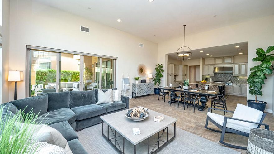 Located in the heart of the prestigious PGA West Signature community, this stylish 3-bedroom, 2.5-bath home offers light-filled luxury just a one-minute golf cart ride from the Palmer, Nicklaus, and Stadium courses, clubhouse, fitness center, and Ernie's Bar & Grill. Designed for comfort and easy entertaining, it features a neutral, modern design with custom tile, upgraded carpet, and a chef's kitchen with commercial-grade KitchenAid appliances, and a spacious island. The open great room boasts high ceilings, a sleek fireplace, and large sliding doors leading to a private patio with stunning mountain views, sparkling pool, and BBQ area--perfect for relaxing or hosting guests. Make this your perfect desert vacation.