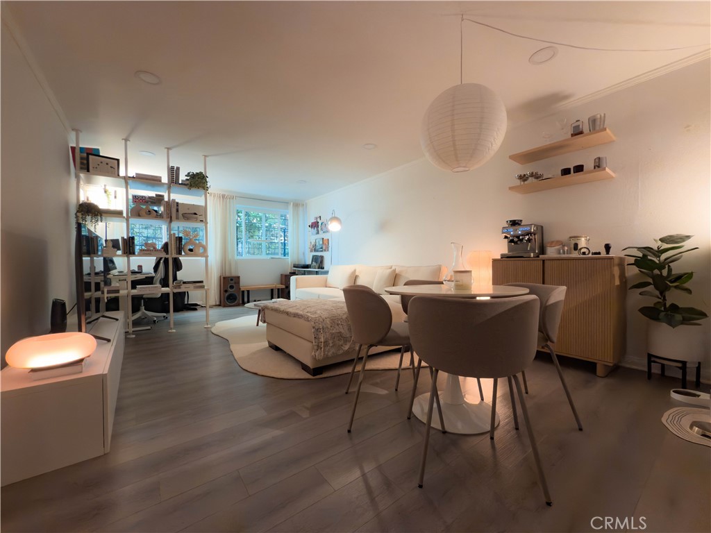 Modern living in the heart of iconic Hancock Park. Located on the historic Rossmore Corridor, this well-appointed condo sits in a quiet, tree-lined neighborhood. Just moments from Larchmont Village. The open floor plan features a sleek modern kitchen with stainless steel appliances, generous counter space, and an in-unit washer and dryer