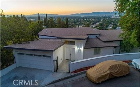 VIEWS! VIEWS! VIEWS! Great for investor or contractor cash only. Plans are approved by the city and waiting for final permit but taking to long. Perfectly nestled in the sought-after neighborhood of Studio City perched near the top of hills, this incredible retreat has stunning panoramic views of the valley, canyon and city lights. Situated on approximately 9,000 sqft lot with largely flat pads. This residence boasts an alluring curb appeal, exquisite features, and a perfectly designed floorplan. With 4 bedrooms, 3 bathrooms, and 2,419 square feet of impeccable living space. Entering into an open floor plan ideal for entertaining with incredible glass wall view to the Valley. Enjoy your kitchen into your patio with views of the hills, beautiful kitchen cabinets with quartz counter tops and with a chef stove. On the first floor is a spacious bedroom suite with wall-to-wall closets and open to the yard with verdant valley views. The second bedroom can double as an office or flex space that also has direct access to the oversized bathroom with double sink, multiple windows and wall-to-wall tiled bathtub/shower combo. Additional features include vaulted ceilings, two car garage, tankless water heater, recessed lighting and designer details. A truly one of a kind property that offers the best of Los Angeles living!