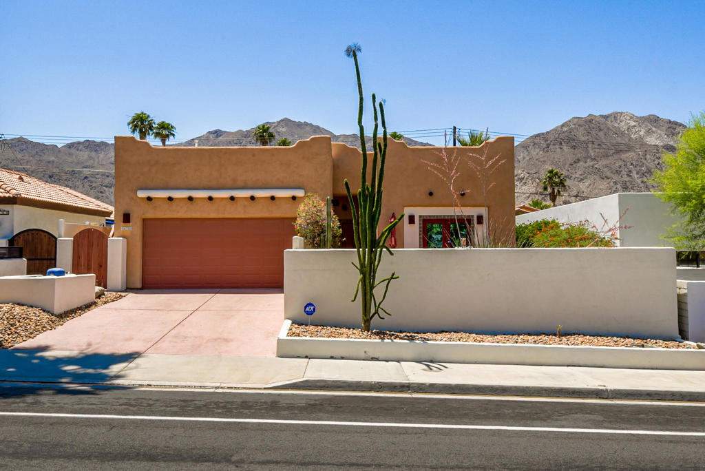 Welcome to the beautiful La Quinta Cove, where this fantastic location offers the best of both worlds. You are ideally tucked away in the cove, while also located just minutes away from restaurants, shopping, entertainment, and more! Hiking trails are within short walking distance. This Santa Fe style home offers 3 bedrooms, 2 full baths, and an enclosed front courtyard. Master bathroom is equipped with dual vanity sinks and tiled shower. There is no carpet in this home, the bedrooms were recentley upgraded to wood flooring. Beautiful French doors in the great room offer tons of natural light and provide easy access to the private courtyard with amazing mountain views. There is also a patio rooftop that offers a stunning view. The fireplace in the Great Room is perfect for those cold winter nights. You can save on utility costs with high efficiency windows! This is a picturesque desert home with Spanish tile floors and colorful tile accents in kitchen and bathrooms. The laundry room is equipped with a washer and dryer. Amazing location that offers ideal desert living!