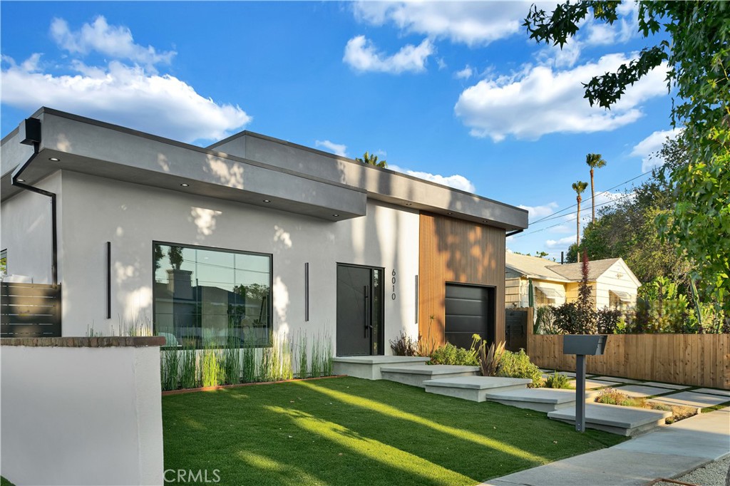 Come see this beautifully almost brand new- 3-bedroom, 3.5-bathroom pool home in Encino, offering 2,107 sq. ft. of stylish living space. The impressive 12-foot-high entry ceiling and pivot front door create a grand first impression, while high ceilings of 10 feet, throughout the house, make the home feel open and spacious. The layout includes a generous junior suite and a large primary master bedroom with a stunning walk-in closet and fireplace. The brand-new chef’s kitchen has plenty of cabinets, brand new appliances and features Taj Mahal natural stone countertops and backsplash, opening to the dining and family room for effortless entertaining. Recessed lighting throughout the house, family room has a modern fireplace. Large sliding doors flood the space with natural light and connect you to the backyard retreat. Outside, enjoy the sparkling Baja-style pool with mini pebble plaster finish, surrounded by drought-resistant landscaping and synthetic grass for year-round beauty and low maintenance. This modern home has been thoughtfully upgraded with new heating and air conditioning, updated electrical and plumbing, and built-in sound speakers in the living area. This beautiful home has a laundry room with ample cabinets. There is a solar panel system. Located close to shops, parks, and quick access to the 101 Freeway, this home blends convenience with luxurious California living.
