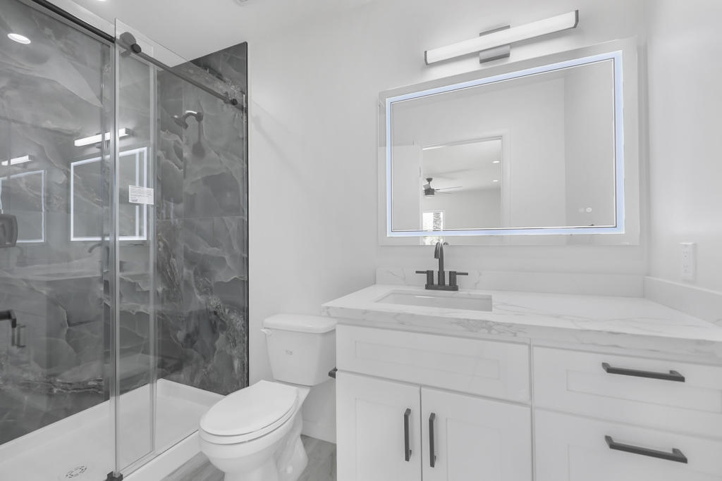 This beautifully updated 2-bedroom, 2-bathroom condominium offers an inviting blend of comfort and style. Recent upgrades include all new dual-pane windows and sliding doors, a fully renovated kitchen with modern cabinetry and finishes, and two tastefully redesigned bathrooms. Additional enhancements feature new ceiling fans, wide-plank flooring throughout, and a brand-new water heater. The private backyard frames stunning mountain views. The private backyard is finished with low-maintenance synthetic turf--offering year-round greenery without the upkeep--framed by unobstructed mountain views. Situated in a well-kept and conveniently located community, this residence delivers both comfort and convenience in a serene setting. a rare opportunity to enjoy turnkey living in a prime setting.