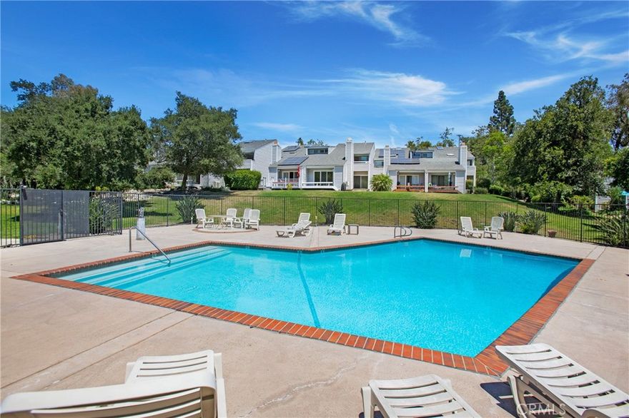 This completely remodeled  townhome has the luxury of new home features with exceptional square footage in the guard-gated community of Coto de Caza.  This highly desirable townhome has been completely redesigned with both functionality and elegance in mind.  From the moment of entry, the stylish white oak LVP wood flooring, smooth finished drywall, and updated finishes reflect a five-star hotel.  This exceptional home offers 3 individual spacious bedrooms en-suite, 2 separate staircases (great rental income if desired).  Two areas of the home are complete with kitchenettes and retreat areas (2 bedrooms with direct outside access via deck or patio).  Medium-toned contemporary cabinetry (with soft-close drawers and cabinet doors), crisp white quartz in the main kitchen and kitchenettes make for a clean, streamlined look.  Stainless steel appliances, white porcelain sinks, and modern cabinet hardware complete the rooms.  The main kitchen offers bar seating and a large pantry.  The downstairs area opens to the dining area and family room with a floor-to-ceiling stone fireplace and cathedral ceilings.  The large, new sliding glass door brings the outdoors in.  The currently in process new Trex deck overlooks the community pool, greenery, and walking path.  Only the best materials have been incorporated in all 3 bathrooms.  Spacious in size, the contrast of the cabinetry with white Quartz, white tile, and high-end shower enclosures are stunning!  Taken down to the studs- every aspect of the home has been updated.  Including insulation, windows, skylights, sliding glass doors, new plumbing, and electrical (added can lighting and fans as well).  An integrated alarm system and security cameras enhance your peace of mind.  For added convenience, a new 3-zoned high-efficiency HVAC system (including all new ducting) with Wi-Fi-enabled thermostats allows for easy climate control.  An included stackable washer and dryer are located downstairs.  Ample storage is provided throughout the home.  The property features a two-car carport with storage as well as another designated parking spot.  The home is located in the heart of The Village with walking paths, hiking trails, parks, and a dog park.
