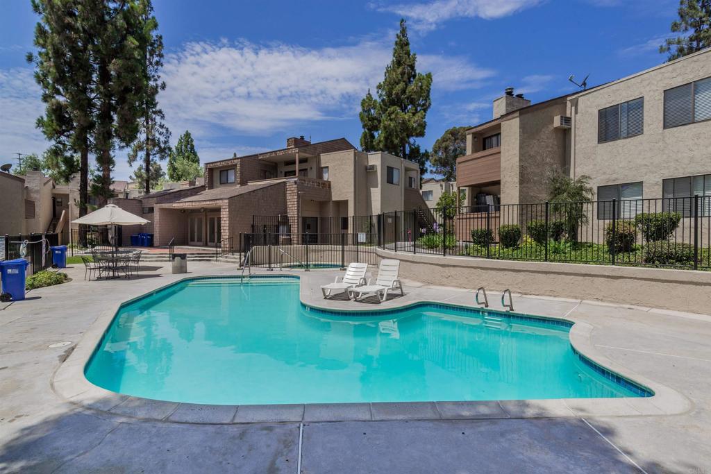 Bright and sunny top-floor unit featuring vaulted ceilings and skylights that flood the space with natural light. Enjoy cozy evenings by the fireplace in the inviting living room, or step out onto the private balcony for fresh air. The unit also offers a designated dining area and a spacious bedroom suite complete with a walk-in closet and a separate vanity area. Community amenities include a swimming pool, carport parking, and on-site laundry. Conveniently located just minutes from the 54 Freeway, this home is priced to sell quickly—don’t miss out!