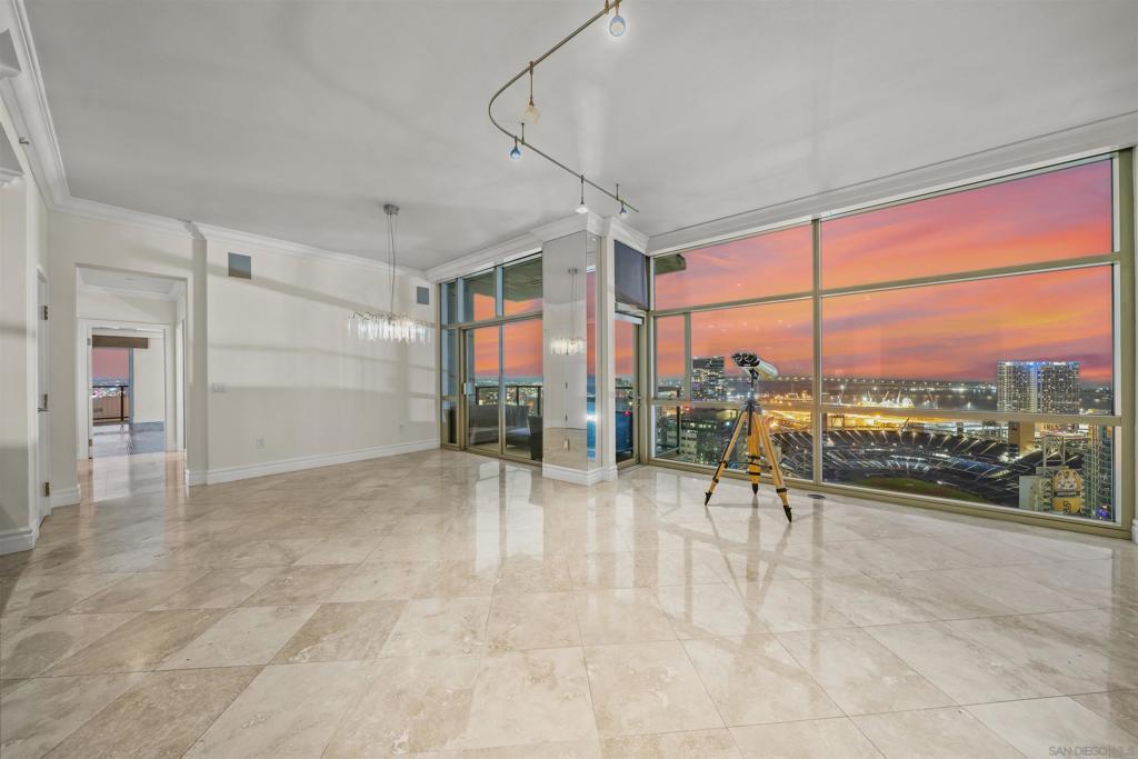 The Mark Residence 2903 – Sky-High Corner Living Unfurnished and available now. Perched on the 29th floor of The Mark, Residence 2903 offers 2,430 square feet of refined indoor-outdoor living with sweeping views of the bay, ocean, Coronado, the Coronado Bridge, Petco Park, and the downtown skyline. This 3-bedroom + den, 3.5-bath corner home features floor-to-ceiling windows and soaring 10' ceilings that flood the space with natural light. Designed for both luxury and livability, the residence includes three private balconies—two off the primary suite and one off the living room. All bedrooms are en-suite, and a separate powder room adds convenience for guests. The flexible den space offers the perfect setting for a home office or media room. Additional highlights include two separate HVAC zones, a full laundry room, two assigned underground parking spaces, and a private storage room. The Mark is one of East Village’s most sought-after luxury towers, offering 24-hour security, a saltwater pool and spa, fitness center, conference room, and a beautifully landscaped outdoor entertainment area with BBQs, a pizza oven, and multiple lounge spaces.
