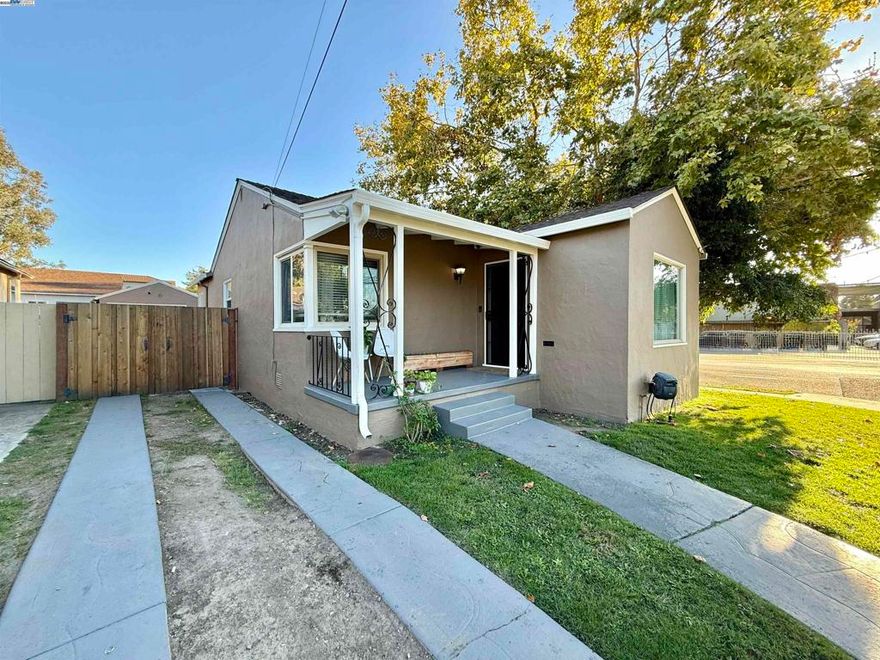 Welcome to this adorable 2-bedroom, 1-bath single-family home offering 1,030 sq. ft. of comfortable living space. Step inside to a bright and inviting living room featuring beautiful hardwood floors and an updated fireplace — perfect for cozy evenings. The adjacent dining room also boasts hardwood floors, creating a warm and cohesive flow throughout the main living areas. The galley-style kitchen has been refreshed with new flooring, granite countertops, and a convenient built-in bench seating area, ideal for casual meals or morning coffee. Both bedrooms are generously sized, and the updated bathroom offers a clean, modern touch. Outside, enjoy a detached garage and a large backyard. Recent updates include a new redwood fence, updated fireplace, crown molding, central heating and air, interior and exterior paint, new water heater, upgraded electrical panel, and new privacy trees with irrigation. This charming home beautifully combines modern updates with classic character — a must-see!