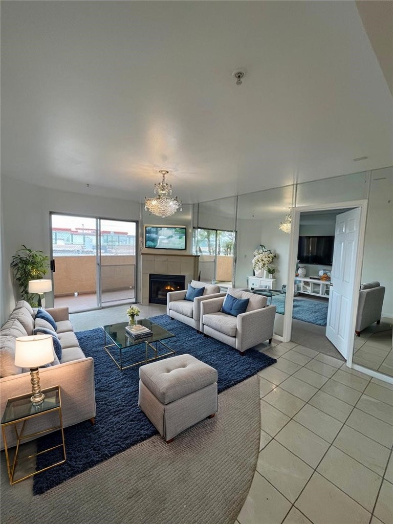 MOTIVATED SELLER! Welcome to Brookshire Manor, a fantastic 55+ Senior Community in a prime location! This freshly painted unit features two bedrooms and two bathrooms, with a spacious open living and dining area that includes a cozy gas fireplace. The living room, dining room, and primary bedroom all have mirrored walls, which make the space feel even larger. The kitchen is conveniently located next to the dining area, perfect for entertaining friends. It comes with brand new carpet, an air conditioning and heating unit, plus a microwave, stove, and dishwasher. Enjoy the convenience of having laundry facilities right inside! The primary bedroom has its own full bathroom with a shower, while the second bedroom has a nice walk-in closet, and there's another bathroom nearby with a shower-tub combo. You can step out to your private patio through the glass sliding door. This condo is situated on the Lido deck, which leads to the clubhouse outdoor patio and includes a storage closet. The condo offers approximately 770 square feet of living space. As a resident of this gated community, you’ll have one assigned subterranean parking space and access to security cameras for extra safety. The HOA covers insurance, water, and trash services. Enjoy the social lounge with a kitchen, gym, entertainment lounge with pool tables, and a lovely courtyard. Plus, there are several elevators for easy access throughout the complex. You’ll appreciate being close to shops, restaurants, and the Downey Theater, with quick access to PIH Healthcare and various medical facilities, as well as freeways 5 and 605. And the best part? Pets are welcome!