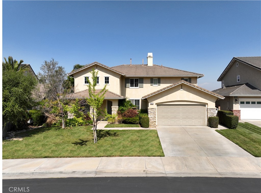 Welcome to 16673 Carob Ave — a beautiful home nestled in a quiet and safe Chino Hills neighborhood. This spacious residence boasts an open-concept floor plan with beautiful custom wrought iron stair rails and high vaulted ceilings in the living room that create an airy and inviting atmosphere from the moment you walk in. Elegantly designed with wide baseboards, crown molding, white plantation shutters throughout, the home features 5 bedrooms and 3 full bathrooms with a multi-purpose room perfect for a home office, gym, or a playroom - flexible for today’s lifestyle needs. The current formal dining room was previously a bedroom, but could easily be converted back into a downstairs bedroom with a full bathroom next to it. The living and dining areas flow seamlessly, making it ideal for entertainment and everyday living. The kitchen has a large workplace island that also serves as a breakfast bar. Granite counters, tile backsplash, stainless steel sink and dark stained cabinetry give the home a clean and modern look.
Upstairs, the generously sized primary suite has a great view of the city lights creating a tranquil retreat at the end of the day. Step outside to the private backyard, where you can enjoy your morning coffee or unwind in the evening while taking in the peaceful surroundings.
Located in a highly desirable and welcoming community, this home blends comfort, style, and functionality. Nearby top-rated public schools add even more appeal to this exceptional home. Recent upgrades include a newly installed water heater and EV charger-ready setup for added convenience.