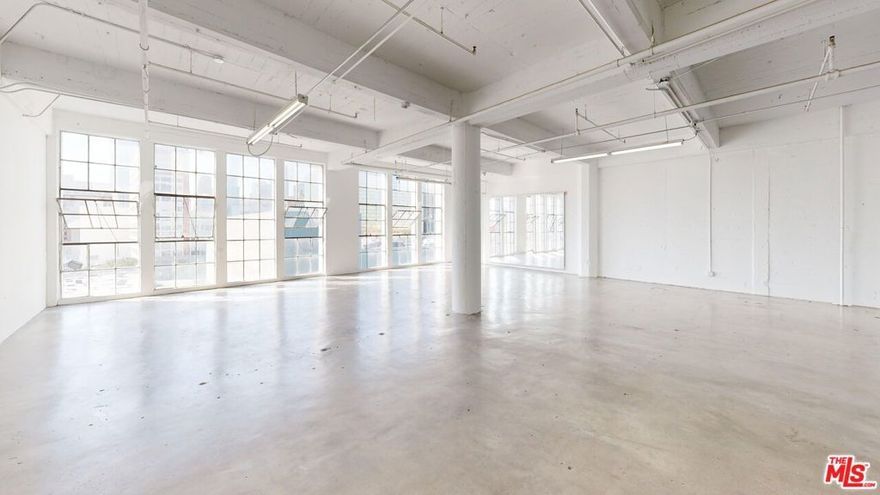 Industrial warehouse-style creative space located in the heart of the Downtown Los Angeles Garment District. This 5th-floor suite offers amazing city views, high ceilings, sandblasted concrete walls, refurbished windows, and a separate private office. Direct front access to vibrant Santee Alley retail. Ideal for creative office, showroom, or production use. Landlord covers CAM, property taxes, insurance, and utilities (except tenant's electricity). Walkable to restaurants, shopping, and parking options