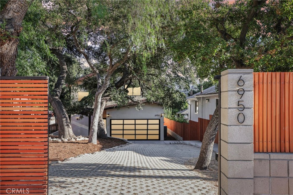 Brand-new construction built this year from the ground up on an empty lot, this home is a rare find in Tujunga, where new builds are almost unheard of. Thoughtfully designed, this 3-bedroom, 3-bathroom residence blends modern comfort, refined luxury, and an unwavering sense of peace and retreat. Every detail is brand new and under warranty, from the systems and appliances to the finishes and fixtures. The 1,620 sq. ft. interior is filled with natural light, enhanced by multiple skylights, and designed to impress.
The gourmet kitchen features an induction cooktop, smart refrigerator, wall oven, microwave, wine fridge, and an elegant wet bar—perfect for entertaining. A dual-zone central HVAC system ensures year-round comfort. The 6,225 sq. ft. lot is fully gated and professionally landscaped, with mature protected oak trees, lush greenery, a trellis-covered patio, and an automatic sliding driveway gate with LiftMaster motor, creating a true sense of privacy and tranquility.
Additional highlights include a whole-house fire sprinkler system, an invaluable safety feature in fire-prone Los Angeles, and integrated smart home features throughout. Enjoy low-cost, energy-efficient living with 8 fully paid-off solar panels (no lease or loan) and a brand-new 1,000-gallon fiberglass septic system with leach bed, designed for low maintenance with service needed only every 4.5 to 5 years.
Surrounded by elegant landscaping and tucked behind gates, this rare gem offers a lifestyle of serenity, security, and sophistication. With no other comparable new construction currently available in Tujunga, this one-of-a-kind home won’t last—make it yours before it’s gone!