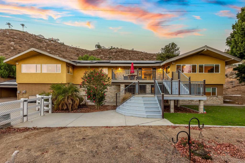Welcome to this Rancho San Diego Oasis. Newly remodeled 6 Bedroom, 6 bath (4 full, 2 half) Rancho San Diego home on expansive lot! Additional large study could be converted into a 7th bedroom if desired. Open & bright floorplan includes inviting entry porch, vaulted ceiling with exposed wood beams, two cozy fireplaces, two full kitchens, large island, high-end appliances, new fixtures, recessed lighting & ceiling fans. Palatial master suite with dual sinks, spa tub, triple-head shower & spacious walk-in closet. Immense 1.3 acre lot includes many separate private outdoor areas: mountaintop area with massive views and parking for dozens, large orchard with mature producing citrus trees, kids yard with trampoline and rope swings, multiple patios, balcony, massive pool, pool casita with half bath, lush landscaping, shade trees, large lawn & mountain views with lots of privacy! This home is located across the street from a golf course, 3 minutes to Target and Ralphs, 10 minutes to downtown La Mesa and downtown El Cajon, 15 minutes to downtown San Diego, 22 minutes to the beach and airport. It is also a rural enclave with quick access to 8, 94, and 125; this home is the best of both worlds. Home is also wheelchair friendly and perfect for multiple generations with two full kitchens, two full laundry rooms, two ACs, two furnaces, separate thermostats, three master bedrooms, lots of parking. Very safe neighborhood, with the addition of new hard-wired Ring Security System installed that includes many LED spotlight cameras and no batteries to charge. Solar system gets great exposure, and many months there is no electric bill! Overall, the home feels even bigger than the official 5070 sq feet due to the expansive outdoor areas integrated into living spaces, the four-car climate controlled garage, and the large shingled lighted three-wall carport next to it for actual parking