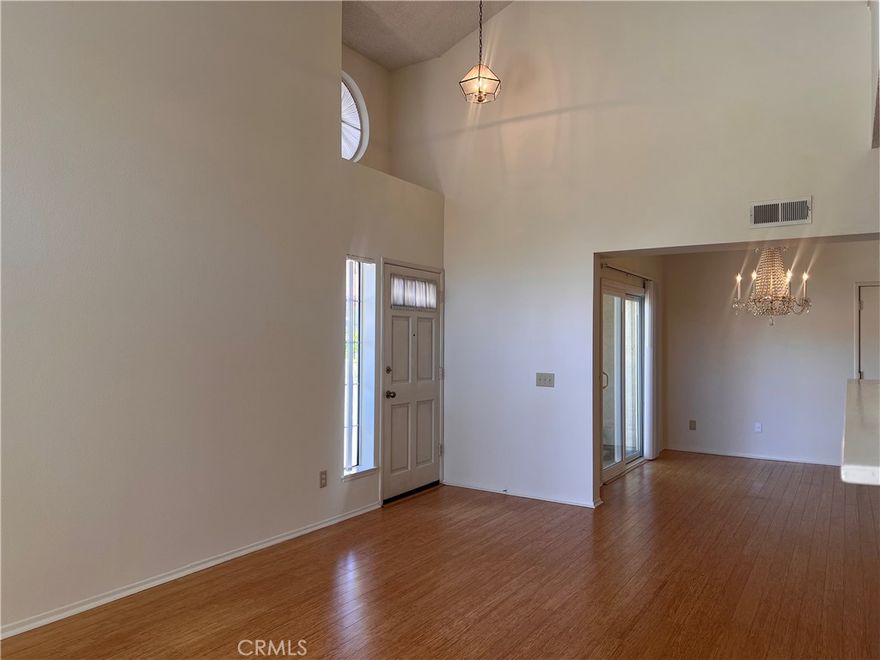 This 2 bedroom + 2 bath + Loft is located in the sought after Las Ventanas gated community in Valencia across from Granary Square. This is a lower end unit with 1 bedroom and bath on the lower level and a primary bedroom and loft upstairs.  This unit is over 1,400 sq ft and features a fireplace in the spacious living room with 2 separate patios downstairs and a balcony off the primary bedroom upstairs. High ceilings with lots of windows bringing in the natural light. Lots of storage areas that include a closet under the stairs, walk in closets and tons of space in the attached 2-car direct access garage. Appliances included are Refrigerator, stove, microwave and full-size washer and dryer located in the garage. Amenities include a community pool, spa and clubhouse. Located close to shopping, restaurants, paseos, the Summit Park, transportation, Henry Mayo Hospital and freeway access. Call now to schedule your showing!