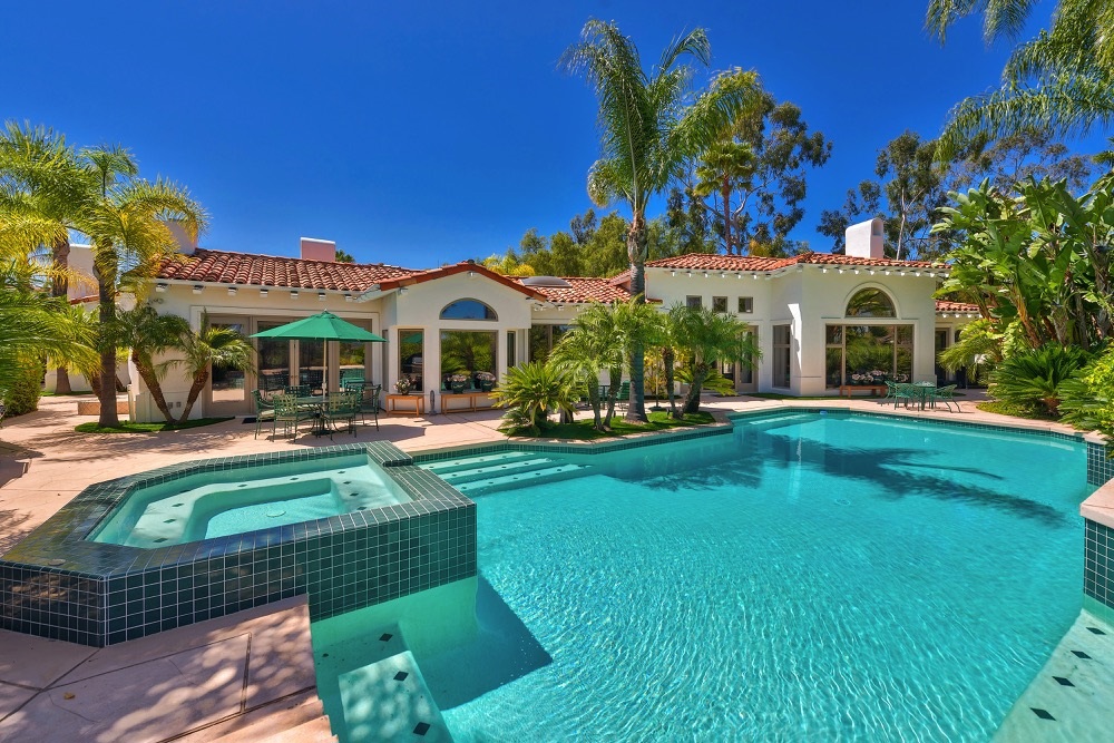Enjoy the good life at this 1-story, 5200+ sq. ft. home in gated community of Highlands Ranch in N. Poway. Home offers mountain views, a sparkling pool w/spa, 4 interior fireplaces plus an exterior fireplace. A recently remodeled gourmet kitchen w/Brazilian granite counters, 5 burner gas cook top & cherrywood cabinets. Wood floors in a spacious family room w/beamed ceiling...master bedroom w/customized closet that is outstanding & master bath has a jetted tub & walk-in shower. OPEN SAT, 10/6 from 1-4 pm. This extraordinary custom home was built by Tony Garczynski. There are dual heating and AC systems; dual hot water heaters, a whole house fan and epoxy garage floor. The lot size is 1.04 acre, however, a portion of the land behind the retaining wall opposite the 3-car garage is maintained by the Homeowner's Association. The structures to the right of the garage are unique beds for planting tomatoes and each one has its own drip system. Owner has directions for producing the best crop ever! There is a community tennis court nearby. Heater for the spa was just replaced in April, 2018. A newer BBQ grill exists on the patio. There is an exterior fireplace.. Neighborhoods: Highlands Ranch Architectural Style: Custom Built View: Custom Built Equipment: Garage Door Opener,Pool/Spa/Equipment, Vacuum/Central, Water Filtration Other Fees: 0 Sewer: Sewer Connected Topography: GSL