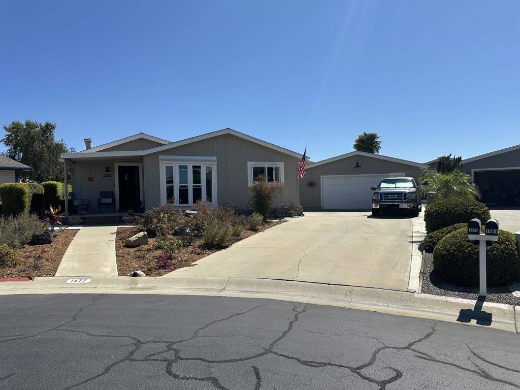 Beautifully remodeled 3 bedroom home in a great location at the end of a cul de sac! Located in beautiful Pilgrim Creek Estates, a highly desirable 55+ gated community where you own the land! This lovely home has been extensively remodeled with a newly remodeled kitchen with shaker cabinets, stainless steel appliances and beautiful counters. Remodeled laundry room with all new cabinets, counters and a stainless steel sink and faucet. Other upgrades include bamboo flooring, remodeled bathrooms and new dual pane windows throughout. Large living room with a custom electric fireplace. Plenty of parking with an extra long driveway with a two car garage leading to a beautiful patio with new landscape, hardscape and new drains. Enjoy the beautiful views from the front porch. Close to all shopping and dining and a short drive to beaches and harbor. Pilgrim Creek Estates is a beautifully landscaped community that offers many amenities including a clubhouse with a full kitchen, billiard tables, fitness center, heated pool, jacuzzi and free RV parking. Low HOA fees of $373 per month includes water, trash and sewer fees.