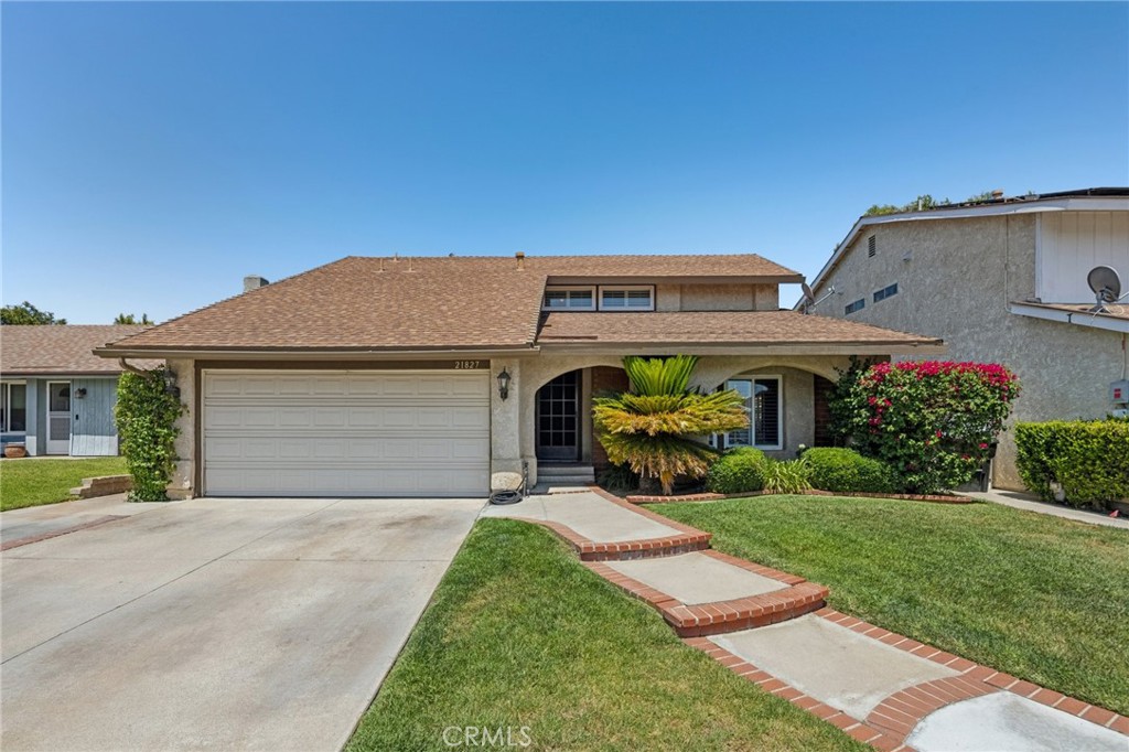 ****PRICE REDUCED**** Light and bright 4-Bedroom Saugus Home with Downstairs Bed & Bath, Low HOA and No Mello-Roos! Welcome to this updated home offering a spacious and functional layout in a prime Saugus location. Inside, you’ll be greeted by updated flooring, vaulted ceilings, and an abundance of natural light filling the open-concept living areas. The kitchen opens seamlessly to the inviting family room with a cozy fireplace—ideal for both relaxing and entertaining. Perfect for multigenerational living or guests, the first floor includes a full bedroom and beautifully remodeled bathroom. Upstairs, the expansive primary suite impresses with vaulted ceilings, a walk-in closet, and a spa-like ensuite bathroom complete with a glass-enclosed shower. Two additional upstairs bedrooms are connected by a convenient Jack-and-Jill bathroom. Recent upgrades throughout the home include new flooring throughout, new paint, and updated bathrooms. Outside, find your private backyard oasis featuring a pergola-covered patio, a grassy play area an ideal space for outdoor gatherings. Located in a highly sought-after community close to Saugus High School, Central Park, shopping, and dining. Enjoy low HOA fees that include access to a pool, spa, clubhouse, playground, park, tennis courts, and sports court—all with no Mello-Roos! Depending on the offer, the Sellers are open to a closing credit for RATE BUYDOWN or Closing Costs.