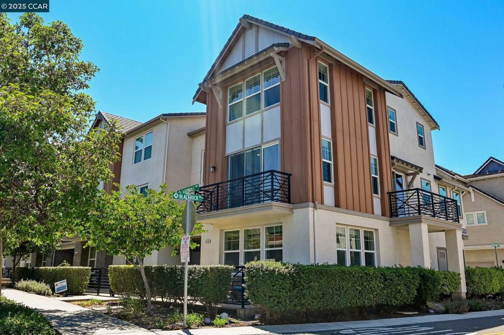 OPEN SUN, 8/3 1:30-4. Beautiful 4-bedroom, 4-bath end-unit townhouse-style home with a flexible floor plan and excellent location. Three of the bedrooms are en suites, offering comfort and privacy for family or guests. The first floor features a private bedroom with full bath and walk-in closet—perfect for guests or a home office. The second floor boasts an open-concept layout with wood-look flooring, a living room with balcony, dining area with second balcony, and a gourmet kitchen with gas stove, stainless steel appliances, and large island. Also on this level are a bedroom, full bath, and laundry room. On the third floor, enjoy a spacious primary suite with walk-in closet, dual vanities, and shower, plus an additional bedroom en suite. Located just 0.2 miles from Cottonwood Creek School, a little over a mile to Emerald Glen High School, and close to Fallon Sports Park, shopping, freeway, and major employers. This stylish and versatile home is move-in ready and perfectly situated!