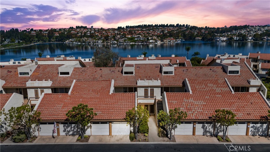 Welcome to this beautifully remodeled 2-bedroom, 2-bathroom ground-level home, nestled in the prestigious Lake Mission Viejo community. This single-story unit offers gorgeous panoramic views, abundant natural light, and an open, airy layout designed for modern living.
Step into a bright and inviting living room, featuring a cozy fireplace and seamless access to a spacious private balcony. It also flows into a comfortable dining space. The kitchen features granite countertops, stainless steel appliances, and a breakfast nook.
The primary suite is a peaceful retreat, offering its own balcony access, a generous walk-in closet, and a beautiful ensuite bathroom with a walk-in shower and dual vanity. The second bedroom is bright and also features a dual vanity and walk-in shower.
Additional highlights include in-unit laundry, a porch, a private 1-car garage, and an assigned covered carport space.
Residents enjoy exclusive access to Lake Mission Viejo’s top-tier amenities—including beaches, boating, swimming, picnic areas, summer concerts, and more.
This turnkey home offers the perfect blend of comfort, style, and resort-style living in one of Mission Viejo’s most desirable communities. Don’t miss the opportunity to make it yours!