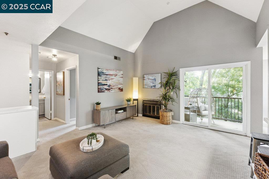 Sophisticated urban retreat! This beautifully updated 1 bedroom,1 bath condominium offers comfort and convenience in a fabulous commuter location near Pleasant Hill BART and 680. Meticulously maintained corner, top floor unit features a bright and airy, open concept living space, ideal for relaxing and entertaining. Upon entry, you are greeted with soaring ceilings and treetop views. Kitchen boasts stainless appliances, natural wood cabinets and a large pantry with stackable washer/dryer. Generous dining area could serve as an office if you wish to work from home. Spacious, open living area features private balcony and fireplace. The wonderful community includes a gym, pool/jacuzzi, clubhouse and lovely BBQ/seating area. Secure entry, elevator and gated garage.
