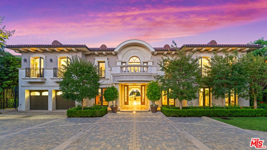 Set on one of the most coveted streets in Brentwood Park, stands this striking custom-built estate. A stunning grand foyer with soaring 20ft ceilings and a dramatic dual staircase that sets the tone from the moment you enter the home. A gourmet kitchen built around the art of entertaining with high-end stainless-steel appliances, tons of counter space, custom cabinetry & a 120 SF island that overlooks the park-like grounds. An oversized royal living room w/ pocket doors that opens to the private patios. Highlighting 7 generous suites, 9 baths including a luxurious presidential suite with a sitting area, large balcony, two walk-in closets and a spa-like bath that rivals any 5-star resort. A wood paneled office with private entrance, an oversized media room, family room with full custom bar, and a private dining room that can accommodate seating for over 20. With custom details at every turn this home exudes elegance & panache. The ultra-private backyard  set on over a 29K SF lot, features an infinity edge pool w/ private cabana, an outdoor kitchen w/ a built-in grill & a large grassy area great for entertaining all year round. This is truly a one-of-a-kind estate built around the art of entertaining with privacy and luxury details not often seen.
