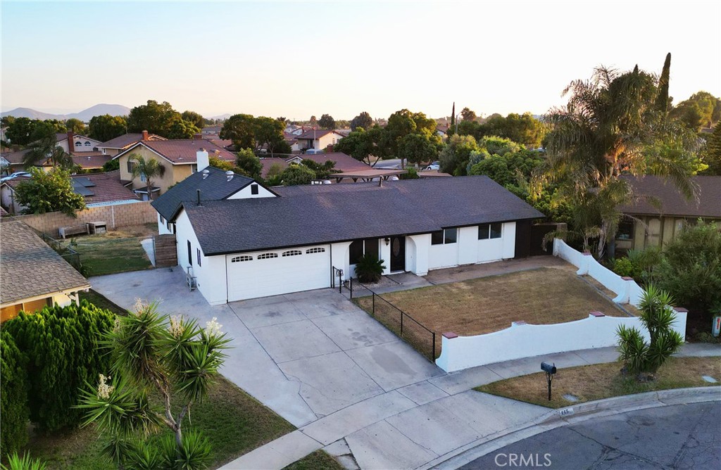 Welcome to this stunning entertainer’s dream home! Recently remodeled, this 4-bedroom, 2-bath residence offers 1,984 sq. ft. of living space on a spacious 10,000 sq. ft. corner cul-de-sac lot. The home features a brand-new composite shingle roof, an upgraded 3-year-old HVAC system with Nest Smart Thermostat controls, new tile and laminate wood flooring throughout, fresh interior paint, new bedroom and closet doors, and fully renovated bathrooms in the primary suite and hallway. The updated kitchen boasts granite countertops, wood cabinetry, tile backsplash, and newly installed ceiling fans.
Two substantial bonus areas provide incredible flexibility (buyer to verify square footage, use, and permits with the city). The front bonus space, located in the converted two-car garage, includes a bedroom, living area, full bathroom, built-in closet storage, and in-wall laundry hookups. The rear bonus space offers an open-concept layout with living, kitchen, and dining areas, a fully built-out kitchen with stainless steel sink, range hood, and gas/electric stove connections, its own bathroom, laundry area, and closet space. An additional finished attic with laminate flooring, recessed lighting, and wall-mounted A/C offers ideal space for an office, recreation room, or extra storage.
The expansive backyard is pool-ready and perfect for entertaining, featuring two covered patio areas, a built-in BBQ station, lush landscaping with a fruit tree, front and rear sprinkler systems, and a large driveway with RV parking capability. Combining style, comfort, and versatility, this exceptional property is truly one-of-a-kind. Schedule your private showing today!
