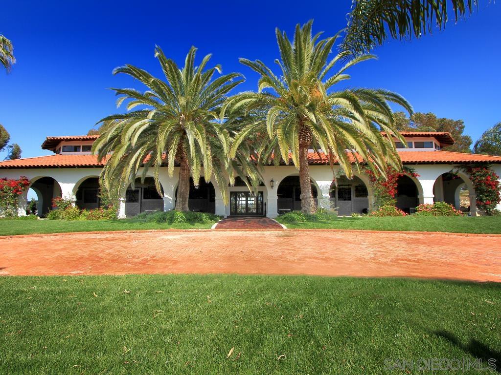 Professional quality equestrian facility on 5.4 acres, located just southeast of Rancho Santa Fe, 10 minutes from Del Mar Horse Park or village of RSF. Property includes 38 total stalls, large arena with quality footing/base for grand prix jumpers or dressage, longing arena, 4 turn outs, and a manufactured home suitable for caretaker housing. Also: equine treadmill, wash racks, tack rooms, office and lounge, large storage area. Ride with views and coastal breezes! New owner may consider lease of equestrian facilities. The Mediterranean style main barn houses 16 horses with a luxurious office. A second T-shaped barn houses 20 horses with an office/lounge, wash racks, tack/feed room and large storage room. A third prep barn contains 2 stalls, multiple cross ties, wash rack, feed room and tack room. Private, peaceful setting with gated access overlooking the Crosby Estates, plus deeded access through the Zumaque gate. Two APN's, one legal parcel. New owner may consider lease of equestrian facilities.