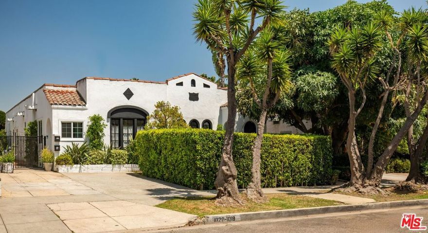 Exceptional Spanish-Style Triplex in Prime West Hollywood. This meticulously maintained Spanish-style triplex exemplifies timeless architectural elegance and pride of ownership in one of West Hollywood's most desirable neighborhoods. Privately situated behind secure gates, the property is enveloped by professionally designed, lush landscaping that creates an immediate sense of tranquility and exclusivity. A manicured front lawn welcomes residents and guests to a palapa-covered outdoor dining pavilion -ideal for sophisticated al fresco entertaining while an elegant fountain in the rear courtyard provides a serene retreat from the vibrant energy of the city. The property features two generously proportioned units at the front, each offering two bedrooms and two bathrooms. Both residences include expansive living and dining areas, along with a spacious primary bedroom featuring a dedicated desk or seating area with direct access to the landscaped rear garden. The secondary bedroom in each unit provides versatile space suitable for family, guests, a home office, or creative studio. Interiors have been thoughtfully updated with designer-quality finishes while preserving the property's original Spanish architectural character. Notable features include custom built-ins, upgraded kitchens finished with premium materials, and enhanced storage solutions throughout. The rear residence is a charming two-bedroom, one-bathroom home complete with private in-unit laundry. This standalone dwelling offers a quiet, independent living experience ideal for long-term tenants, guests, or supplemental income generation. Additional Amenities: The front units share a dedicated common laundry area and benefit from off-street parking- highly sought-after feature in this prime West Hollywood location. This thoughtful configuration provides new ownership with flexibility for personal use while maintaining strong rental income potential. Investment Opportunity: With its authentic Spanish character, inviting indoor-outdoor living spaces, and high-demand location, this triplex represents a rare opportunity to acquire a trophy asset with established income streams and significant upside potential.