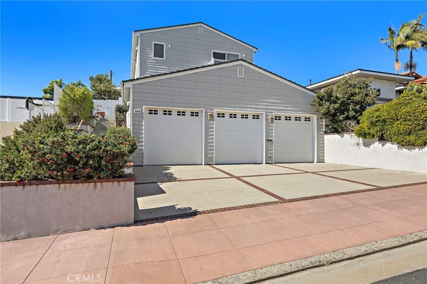 Just a short distance from the shimmering Pacific Ocean, this home embodies the quintessential Southwest San Clemente lifestyle—a perfect balance of laid-back coastal charm and comfortable, everyday beachside living. Here, every day feels like a beachside retreat. Ride your golf cart to neighborhood gatherings or Avenida Del Mar’s boutique shops and restaurants. Walk or bike to the popular T Street and Lost Winds beach or surf world-renowned Trestles just minutes away. The home itself radiates warmth, offering the ambience of a welcoming embrace the moment you step inside. This custom residence, lovingly built and held by the original owner, captures the heart of a true San Clemente beach home. The entry opens into a sunlit living space, where soaring ceilings, picture windows, and a sliding glass door create a sunny sanctuary filled with ocean breezes. Wood floors carry throughout both levels, setting a timeless tone. The formal living room, anchored by a dual-sided fireplace shared with the family room, invites gatherings both large and small. Across from the living room, the formal dining room offers an elegant space for entertaining. Toward the back of the home, the kitchen, breakfast nook, and family room flow together seamlessly, creating the perfect hub for everyday living. A main floor bedroom and bathroom add flexibility for guests or multigenerational living. For added convenience, there are laundry facilities on both the first and second floor. Ascending the stairs, you’re welcomed by an airy landing with built-in bookshelves and a seating area where the OCEAN VIEW creates a perfect setting for reading or relaxing. The OCEAN VIEW PRIMARY SUITE is a retreat of its own, generous in scale with a fireplace and sliding doors that open to an ocean-view deck. The ensuite bathroom features dual sinks, tiled flooring and counters, a soaking tub, a walk-in shower, and an exceptionally spacious walk-in closet. Two additional sunlit GUEST BEDROOMS, EACH WITH OCEAN VIEWS, share a hall bath. Additional highlights include a three-car garage with soaring ceilings—ideal for a car lift—plus driveway parking. Practical enhancements such as a durable metal shingle roof, steel framing, vinyl shingle siding, dual-pane windows and sliders, and dual hot water heaters ensure lasting quality.