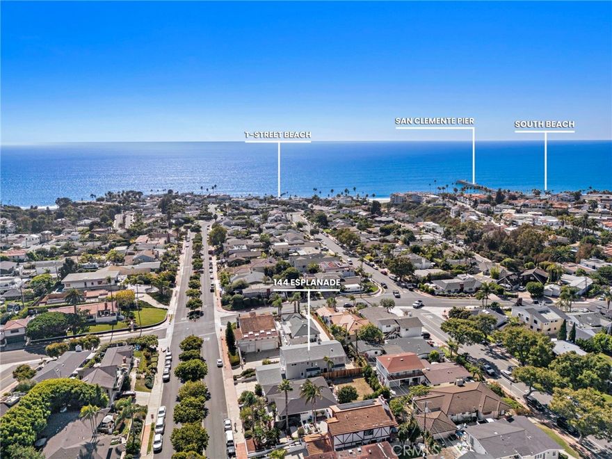 Just a short distance from the shimmering Pacific Ocean, this home embodies the quintessential Southwest San Clemente lifestyle—a perfect balance of laid-back coastal charm and comfortable, everyday beachside living. Here, every day feels like a beachside retreat. Ride your golf cart to neighborhood gatherings or Avenida Del Mar’s boutique shops and restaurants. Walk or bike to the popular T Street and Lost Winds beach or surf world-renowned Trestles just minutes away. The home itself radiates warmth, offering the ambience of a welcoming embrace the moment you step inside. This custom residence, lovingly built and held by the original owner, captures the heart of a true San Clemente beach home. The entry opens into a sunlit living space, where soaring ceilings, picture windows, and a sliding glass door create a sunny sanctuary filled with ocean breezes. Wood floors carry throughout both levels, setting a timeless tone. The formal living room, anchored by a dual-sided fireplace shared with the family room, invites gatherings both large and small. Across from the living room, the formal dining room offers an elegant space for entertaining. Toward the back of the home, the kitchen, breakfast nook, and family room flow together seamlessly, creating the perfect hub for everyday living. A main floor bedroom and bathroom add flexibility for guests or multigenerational living. For added convenience, there are laundry facilities on both the first and second floor. Ascending the stairs, you’re welcomed by an airy landing with built-in bookshelves and a seating area where the OCEAN VIEW creates a perfect setting for reading or relaxing. The OCEAN VIEW PRIMARY SUITE is a retreat of its own, generous in scale with a fireplace and sliding doors that open to an ocean-view deck. The ensuite bathroom features dual sinks, tiled flooring and counters, a soaking tub, a walk-in shower, and an exceptionally spacious walk-in closet. Two additional sunlit GUEST BEDROOMS, EACH WITH OCEAN VIEWS, share a hall bath. Additional highlights include a three-car garage with soaring ceilings—ideal for a car lift—plus driveway parking. Practical enhancements such as a durable metal shingle roof, steel framing, vinyl shingle siding, dual-pane windows and sliders, and dual hot water heaters ensure lasting quality.