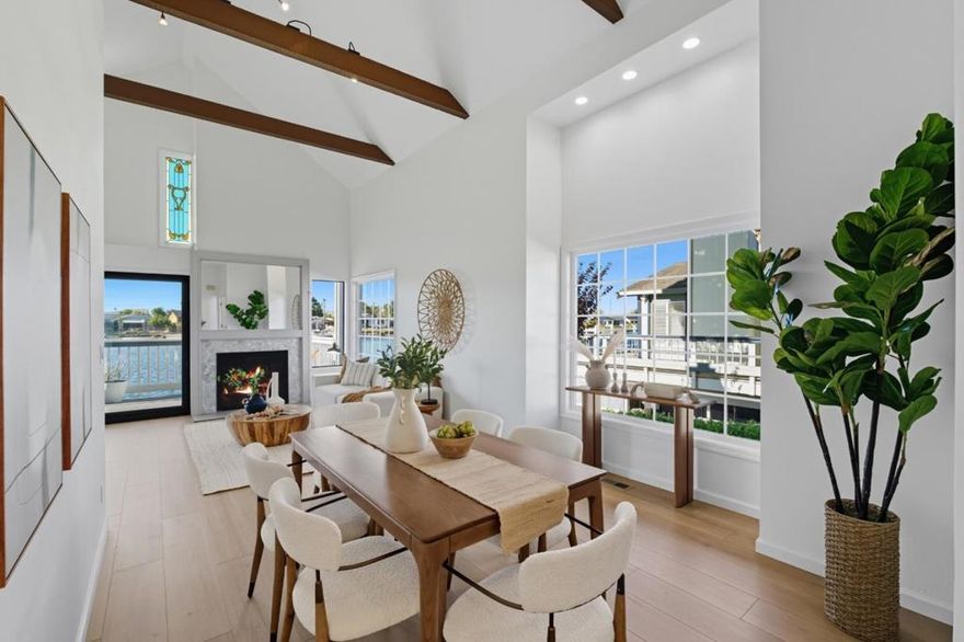 Overlooking the lovely lagoons of Mariners Isle, this stunning 2 bed 2 bath home is the perfect space for anyone! The light filled home is gorgeous, with vaulted ceilings and skylights, overlooking the lagoons with an oversized deck and private dock. Featuring updated floors and designer touches throughout the entire space. Kitchen features all new stainless steel appliances, new countertops, backsplash & hardware. The primary bedroom is a sanctuary, with built in cabinetry, a walk in closet, skylights and direct access to the deck overlooking the water. The primary bath features a new soaking tub and dual vanities. The secondary bedroom features ample closet space and can double as an office. With plenty of parking and an attached 2 car garage with built in storage and washer/dryer. One of the few units on the water also with your own grassy yard space! Low HOA with all the amenities: community grilling areas, pool, spa, optional clubhouse and dry boat storage. On a quiet street with no through traffic, this home is centrally located and has easy access to everything: only mere minutes to 92 and 101, shopping, restaurants, gym and all other amenities. Experience your own luxurious lagoon living in the heart of the Peninsula today!