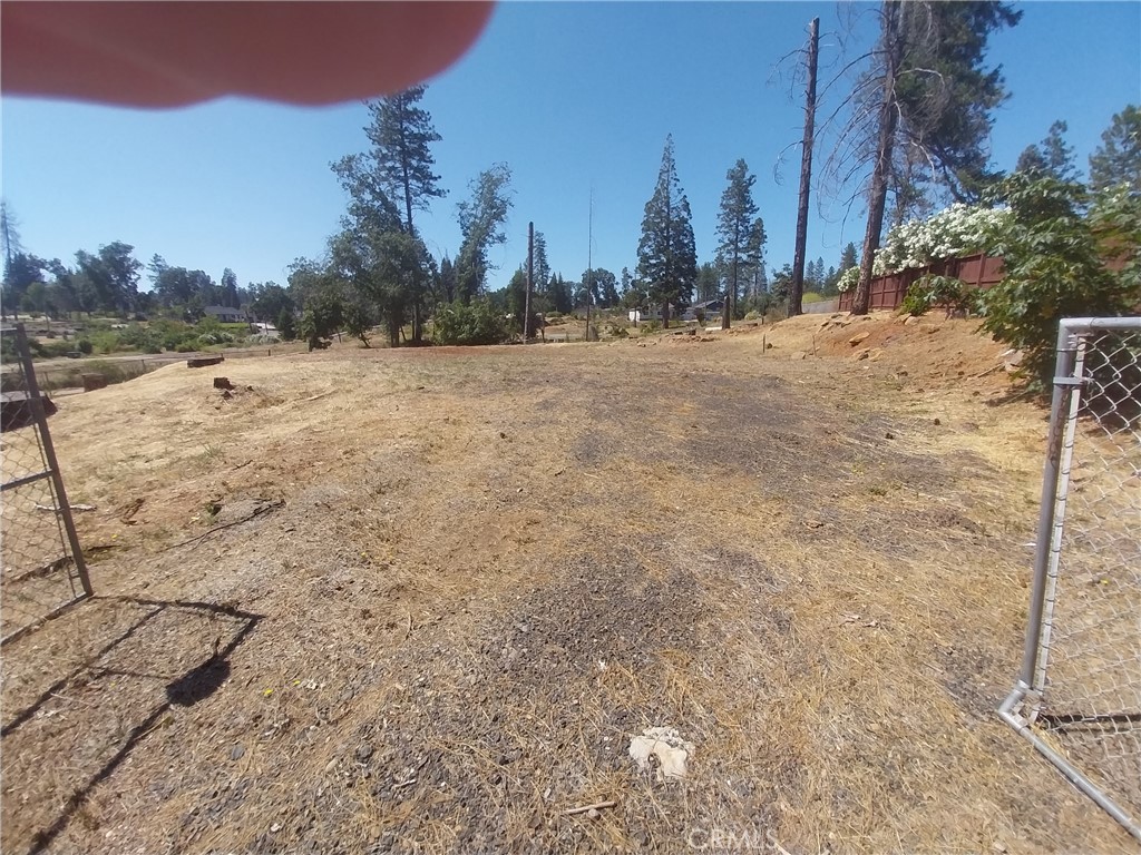 Build-Ready .29-Acre Lot in Paradise, CA – Featuring a Newer Septic System
Seize the rare opportunity to own this cleared and level .29-acre lot in the heart of Paradise, CA—complete with a modern septic system installed just before the 2018 Camp Fire. With current septic regulations becoming more stringent, this functional and up-to-date system is a significant asset that saves both time and money in the building process, offering a strong head start for your construction plans. The back of the lot is bordered by another
lot where the house is far away from this building site giving you considerable privacy.
Nestled in a quiet neighborhood and just minutes from shopping, dining, schools, and other local amenities, this property also offers easy access to a nearby asphalt hiking and biking trail, making it perfect for those who value both convenience and outdoor recreation.
Whether you're looking to build your forever home or invest in one of Paradise’s most promising areas, this lot is ready for your vision. With infrastructure already in place and the groundwork laid, all that’s left is to bring your dream home to life.
Opportunities like this don’t last—schedule your visit today and explore the potential this lot has to offer!