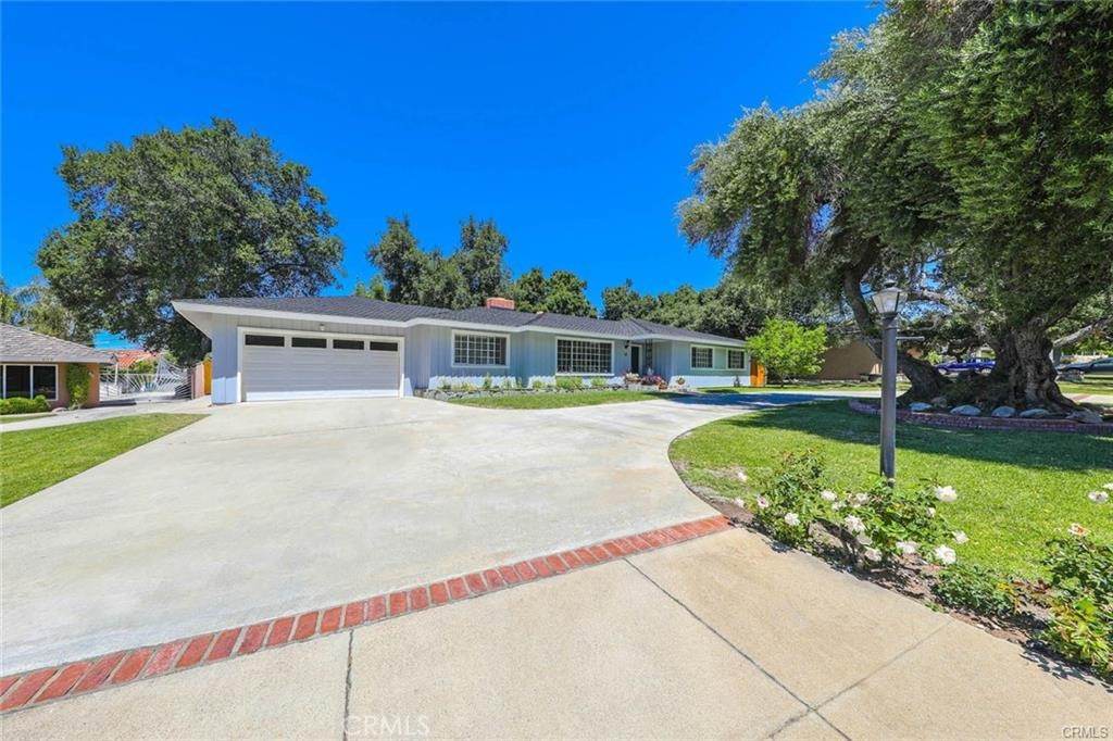North Glendora ranch-style pool home, ideally situated on a generous lot within walking distance to award-winning schools. This thoughtfully maintained residence blends warmth, functionality, and style, offering an easy, comfortable lifestyle both indoors and out.
Beautiful hardwood floors run throughout the home, complementing the abundance of natural light that fills each room. The spacious layout includes a formal living room, formal dining room, and a separate family room—each offering its own unique space to gather, relax, or entertain.
The updated kitchen opens to a large breakfast nook wrapped in windows, inviting in morning light and providing tranquil views of the backyard. The home’s seamless indoor-outdoor flow leads to a lush, private yard featuring a sparkling pool and ample room for entertaining.
The primary suite is a peaceful retreat, complete with a custom walk-in closet and a spacious bathroom featuring a jacuzzi tub and walk-in shower. The secondary bathrooms have also been tastefully updated, continuing the home’s fresh, modern feel.
Additional highlights include an EV charger in the garage and a detached workshop area that includes a newer washer and dryer—ideal for hobbies, storage, or creative projects.
This is a well-cared-for home in one of Glendora’s most desirable neighborhoods, offering the perfect balance of classic charm and modern convenience.