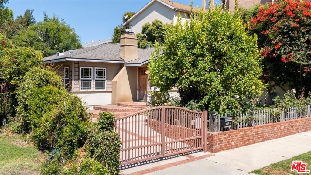 This beautifully updated 3 bed, 2 bath home sits on a gated property and includes a spacious 600 sq ft detached bonus unit with its own bathroom and kitchenette - ideal for a home office or studio space. The perfect property for a live and work from home option! Inside, enjoy hardwood floors, central A/C, a chef's kitchen with stainless steel appliances, custom cabinets, and a large living room with fireplace. The primary suite opens to a private, tree-lined yard and patio. Long gated driveway fits up to 4 cars plus a 2-car garage. Located in the coveted Carpenter School District, just minutes from Tujunga Village and Ventura Blvd shops and restaurants.