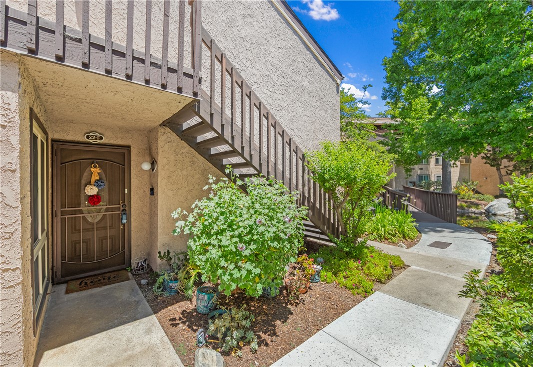 Step into comfort and serenity with this highly sought-after 3-bedroom, 2-bathroom condo located in the peaceful, gated community of El Dorado Lakes. Tucked away in a tranquil enclave surrounded by lush landscaping and scenic lake views, this beautifully maintained home offers the perfect blend of modern updates and resort-style living. Inside, you’ll find a spacious and light-filled layout featuring new luxury vinyl plank flooring throughout. The inviting living room boasts a cozy tiled fireplace, plantation shutters, and sliding glass doors that lead to a large private patio—ideal for relaxing or entertaining with views of the manicured grounds. The remodeled kitchen is a chef’s delight, showcasing sleek quartz countertops, crisp white cabinetry, stylish gold hardware, eye-catching pendant lighting over the breakfast bar, and stainless-steel appliances including a full-size dishwasher and built-in microwave. The adjacent dining area is perfect for gatherings, complete with elegant built-in mirrored china cabinets offering both style and storage. Retreat to the primary suite featuring a walk-in closet, additional linen storage, and a private en-suite bath. The second bedroom includes a mirrored closet, while the third bedroom is flooded with natural light and enjoys private patio access with peaceful greenbelt views. A built-in A/C wall unit ensures year-round comfort. Enjoy the convenience of a 2-car attached garage with direct access plus an additional assigned parking spot nearby. Resort-style amenities include 2 swimming pools and 2 spas, 2 tennis courts, Gated entry with controlled access, clubhouse with exercise room, sauna, library, billiards and ping pong tables, and outdoor deck with pretty lake views. Unbeatable location! Walk to El Dorado Park, nature center, dog park, and golf course, or hop on the nearby bike trail to the beach. Conveniently close to shopping, dining and easy access to 605 & 405 freeways.