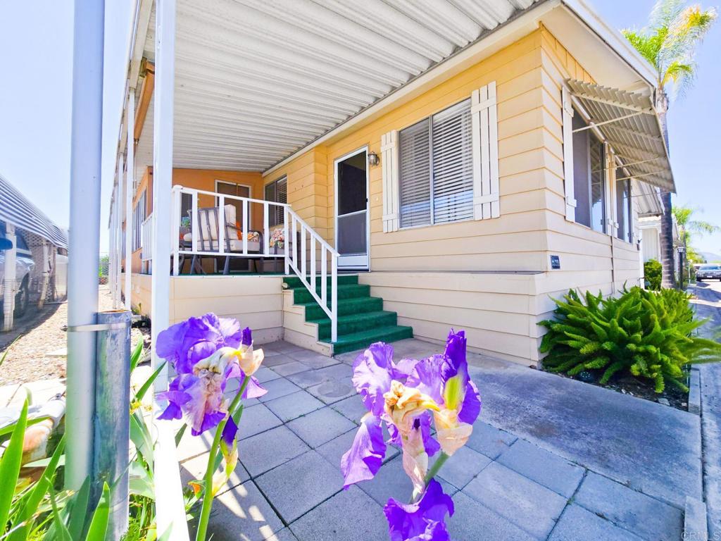 ESCALATING RENTS GOT YOU DOWN! Take some control with 55+ mobile home park ownership and land lease that beats high rent. This 2-bedroom, 2-bathroom mobile home offers a generous 1640+ square feet of living space and NEW ROOF on both home and shed. The plus square footage is an enclosed craft/work space with plenty of countertop and storage. A large living room moves right into a spacious dining area with built in hutch creating an inviting space for relaxation and entertainment. The open floor plan seamlessly connects the kitchen and family room with easy access to the bonus area. The Primary bedroom and large bathroom features a sunken tub and architectural accents that make this a tranquil retreat. Guest room with attached guest bath off laundry room. Tandem 2 car, carport. Fully appointed work shed. Recline in the backyard overlooking expansive pasture land. Plus enjoy all the 55+ Community has to offer.