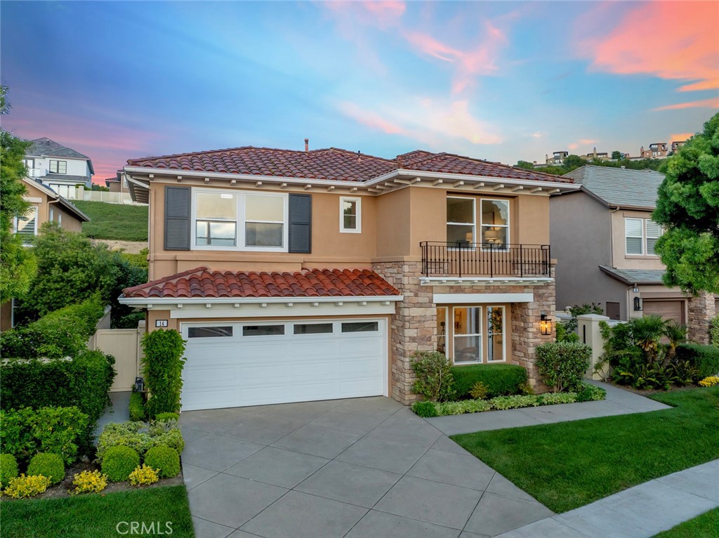 Located within the prestigious gated community of Campobello, this beautifully upgraded residence is being offered for the first time since its original construction and offers an ideal blend of space, comfort, and coastal charm. Spanning approximately 2,762 square feet, the home makes a striking first impression with soaring 18-foot ceilings and an abundance of natural light.
The open-concept layout flows effortlessly from the formal living room to the dining area, while the updated kitchen, with quartzite natural stone counters, a Wolf cooktop, double ovens, stainless steel appliances, and soft-close cabinetry, opens to a spacious family room with a cozy fireplace, perfect for everyday living and entertaining. The backyard is equally inviting, featuring a built-in BBQ area and ample space to relax or gather with friends.
A desirable main-level bedroom with French doors opens to the gated front patio, perfect as a guest suite, home office, or multi-generational space. Upstairs, three generously sized bedrooms include a luxurious Master/primary suite with a spa-inspired bath featuring a standalone soaking tub, separate shower, and a large walk-in closet. The two upstairs secondary bedrooms and the downstairs bedroom enjoy corridor, peek-ocean, and city light views.
Additional highlights include quartz countertops in the bathrooms, custom tile work, and access to Campobello’s private pool and spa. Residents also enjoy Newport Coast Master Association amenities, including a Junior Olympic pool, spa, clubhouse, BBQ areas, tennis, pickleball, basketball courts, and expansive parks and playgrounds. Moments to 1,000s of acres of CA state protected land with scenic hiking and biking trails, sports park, Fashion Island, freeway access, award willing schools, and world class beaches, live the good life that Newport Coast has to offer.