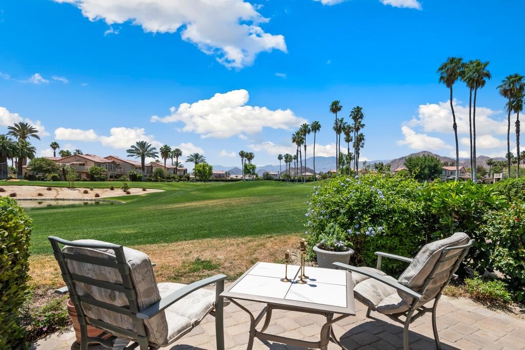 Welcome Home to the gated Palm Royale Country Club community! This Condo features 2 bedrooms and 1.75 bathrooms, with a spacious floor plan, vaulted ceilings, plantation shutters, in-unit laundry, included appliances, a 1-car garage, and the exterior was recently painted in 2024! The Great Room with living and dining area offers plantation shutters, carpet floors, lots of natural light, and a slider to the patio with relaxing golf course views. The kitchen offers tile counters with bar overhang, wood cabinetry and plenty of storage space. Both bedrooms are generously sized with the primary suite offering a private bathroom, there is also a hall bathroom for the secondary bedroom and guests to share. Additional upgrades include all new vinyl double pane windows and sliding door installed in 2021, instant hot Water Heater 2021, HVAC 2006 Enjoy many community amenities including Golfing at the desirable community course designed by Ted Robinson (one of the best par 3 courses in the entire Coachella Valley), as well as Pickleball, Tennis, 6 community pools and spas to choose from, Fitness Center, Clubhouse. The HOA fees also include UNLIMITED Golf, High-Speed Internet, Cable TV, Sewer, Trash, and grounds maintenance. Located across the street from the Indian Wells Tennis Venue (host to BNP Paribas Open Tennis Tournament), also near many shopping and dining options! Schedule your tour today!