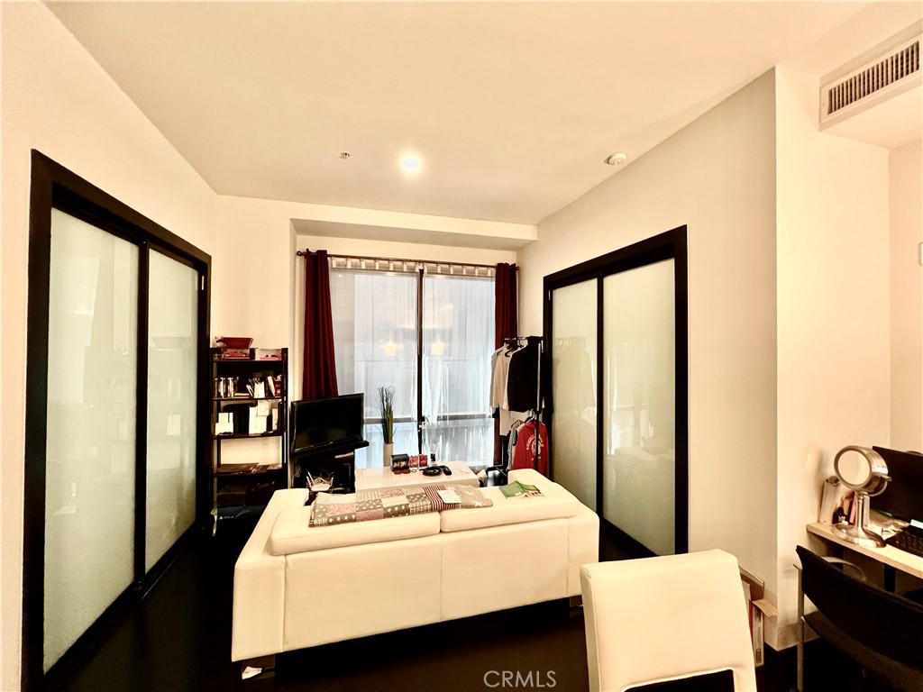 Quiet and serene unit. TRIPLE pane - YES 3x glass upgraded to block sound in both masters. Great for DTLA executives or university students. Masters come with Milguard sliding laminate sound proofing doors that give a luxurious high-end look while retaining lighting and privacy. Deeded Storage included. Live/Work efficient and adaptable living area showcase floor-to-ceiling windows with reflective glass that invite panoramic vistas into a secured and elegant loft. While entertaining guests or simply relaxing at home, you will take pride in the enhanced stainless steel GE Profile gas range, refrigerator, microwave, and dishwasher, washer/dryer. This home also features polished granite countertops, glass showers, solid core entry doors, dark wood cabinetry and rich beech laminate floors. controlled and sound-proof, this home welcomes you into a modern world artfully created. 655 Hope also features onsite Fitness Center open 24/7. Crowning this the Rooftop entertainment and helipad. Pictures are archived photos of common areas in the building and may not represent actual common areas. SOLD AS IS with furniture and seller concessions. Buyer to verify with city on permits and records.