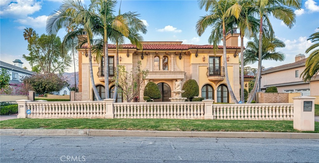 JUST REDUCED!! Nestled in one of Arcadia’s most prestigious neighborhoods, this magnificent south-facing Mediterranean-style estate offers unparalleled luxury and convenience. Set on a quiet street, yet just minutes from Westfield Mall, Santa Anita Racetrack, the Arboretum, Huntington Library, and Caltech, this home provides the perfect balance of privacy and proximity to key amenities.Upon entering, a grand dual marble staircase and exquisite Venetian plaster walls set the stage for timeless elegance. The home features three fireplaces, a spacious gym with a wet bar and film projector, and a breathtaking saltwater fish tank as its centerpiece. Outside, a tranquil Koi pond and resort-style swimming pool, thoughtfully designed with optimal Feng Shui, offer a serene escape.The expansive family room includes a built-in entertainment system and a stunning double-sided fireplace, ideal for hosting gatherings. The gourmet kitchen is equipped with a separate wok kitchen and walk-in pantry, catering to all culinary needs with ease. The backyard retreat is an entertainer’s dream, featuring a built-in BBQ, swim-up bar, and premium surround sound system, making it perfect for both entertaining and relaxation. This estate includes five luxurious suites (including one on the main level), two libraries (one inside the master suite), and two laundry rooms (one upstairs and one downstairs). Climate control is effortless with five zoned air conditioning units, allowing for personalized comfort in every room. The five-car garage offers secure, coded access for ultimate convenience. A rare opportunity to own this extraordinary estate, where luxury, comfort, and impeccable craftsmanship come together seamlessly.