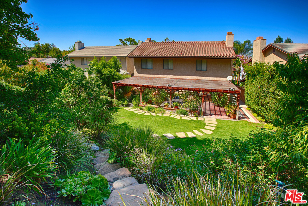 Move right in to this spacious home in a fantastic and desirable, South of the boulevard, Woodland Hills location. This 2-story house is set back from the street with all of the space you need and much more. Downstairs offers a guest bath, a formal dining & living room, remodeled kitchen with granite countertops, dining area & family room. Upstairs, you will find 4 bedrooms (2 of them extra large) and 2 full baths. Rear sliders open to a covered patio, lushly landscaped private yard and room for a pool. Home has been well-maintained with many upgrades. 2 car direct access garage and laundry room inside, central HVAC and ample built-in storage and closet space throughout, making this an extremely functional home. Close distance to Ventura Blvd with grocery stores, many shops and restaurants. Close to Westfield Topanga Village shopping center, great freeway access. The location simply can't be beat. At over 2,300 sf this is a tremendous value for this area. A great home at a great price!