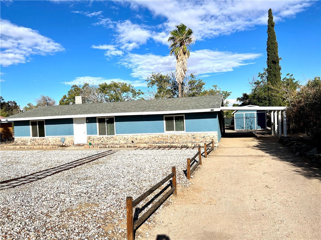 DESIRABLE single-story home on quiet street has fresh interior paint. Located close to schools, shopping & freeway for easy commute. The large level lot has side access for RV parking, all your toys, pool, garden or equipment? Space for family? We've got you! Open-feel floorplan offers two generous bedrooms by updated main bath, then separate primary suite with updated bath. A large primary bedroom has adjacent room to be used for retreat, office, home gym, nursery, or extra bedroom? Attractive tile flooring enhances living, dining and kitchen, which sports granite countertops. Gleaming laminate floors cover bedrooms for low care. Natural daylight streams through dual-pane windows in every room. Ceiling fans and two sliders to rear patio & yard allow fresh air & easy outdoor access. The fenced rear yard has double-gate entry from huge attached carport. Spacious rear yard holds large storage shed, and is dotted with mature trees. There's room for everything you need, maybe even an ADU for family or income? (Check with city for codes) Driveways on both sides of house offer access. This is a great price for a comfortable location, walking distance to one of the best Elem. schools in district. NO HOA or Mello-Roos to pay! Make plans to see your next home today! See supplements for buyer assistance info.**