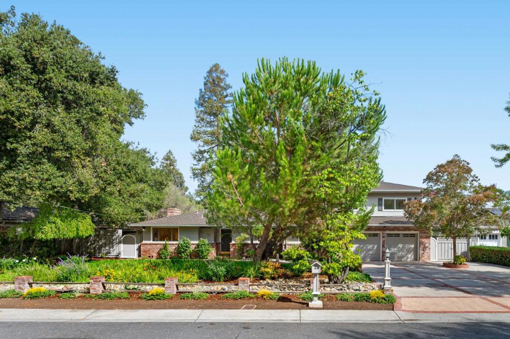 A charming 3-bedroom, 3-bath home nestled on a generous 0.39-acre lot in the heart of Los Altos. Built in 1953, this 2,330 sq ft residence blends classic California ranch architecture with warm wood-frame construction and an open light filled floor plan that offers privacy and flow. The home features spacious living areas, abundant natural light, and an attached garage with ample storage. Located in a quiet, tree-lined neighborhood known for its wide streets and well-maintained homes, this property offers a peaceful suburban feel while remaining close to key amenities. Just minutes from Rancho Shopping Center and downtown Los Altos, you'll enjoy access to boutique shops, cafes, and weekly farmers markets. Springer Elementary School is less than a mile away, and nearby Foothill Expressway and I-280 provide easy commuting to Palo Alto, Mountain View, and Silicon Valley tech hubs. Whether you're looking to renovate, expand, or simply enjoy the timeless charm, this home offers a rare opportunity in one of Los Altos most desirable enclaves with excellent potential to build new and create your dream residence.highly regarded with strong ratings. Just moments away are vibrant parks, boutique shops, and fine dining, all within a peaceful, well-established neighborhood.