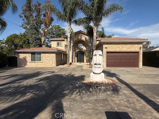 Palatial gated estate available for lease in the heart of Tarzana, just minutes from Ventura Boulevard. This stunning residence offers nearly 6,000 square feet of luxurious living space on a beautifully landscaped 1/2-acre lot. Enter through a private electronic gate into a grand front yard and formal entryway. Impressive iron doors lead into a spacious foyer and expansive formal living, dining, and family rooms—ideal for entertaining on any scale.
The home features four en suite bedrooms, each with its own spa-like marble and stone bathroom and oversized walk-in dressing room. Two bedrooms are located on the lower level along with two fireplaces and a private home theater outfitted with plush velvet seating. The chef’s kitchen is an entertainer’s dream, complete with granite countertops, a large island, and top-of-the-line stainless steel appliances. Large laundry room off the kitchen. Travertine and hardwood flooring run throughout the home, adding timeless elegance. Upstairs, the luxurious primary suite boasts a fireplace, a private balcony overlooking the backyard oasis, an en suite with a Jacuzzi soaking tub, 2 separate his/hers sink areas with granite counters, a large stone shower, and a massive walk-in closet and dressing area. The fourth en suite bedroom is also located upstairs with an adjoining office. Step outside to a true resort-style yard featuring a beach-entry pool with swim-up bar, rock slide, and a 12-person spa. A full outdoor kitchen sits under a large tiki hut, adjacent to a fire pit and a full regulation basketball court. Professionally landscaped front and rear yards complete this exceptional property. This one-of-a-kind estate offers privacy, comfort, and style—an extraordinary lease opportunity in one of Tarzana’s most desirable locations. Close to Ventura Blvd, A+ rated schools, shopping, and the 101 freeway.