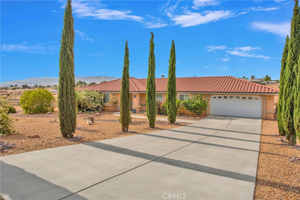 Charming 3-Bedroom Home on Expansive Lot in Hesperia Welcome to this spacious 3 bedroom, 2 bathroom home offering 2,014 sq ft of comfortable living space on a generous 1.75-acre lot. The open-concept kitchen flows into a large living room with a cozy gas fireplace—perfect for entertaining. Features include a formal dining room, inside laundry, and a covered patio ideal for enjoying mountain views. The beautifully landscaped front yard adds great curb appeal, and there’s ample space for RV parking. Don’t miss this well-maintained gem with room to grow!