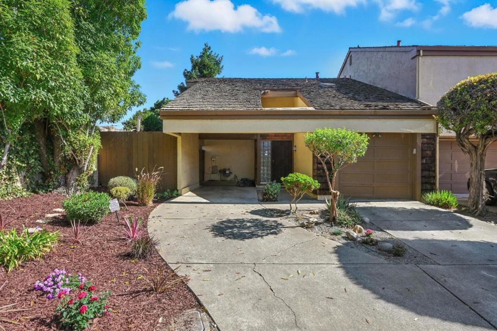 This end-unit townhome offers privacy and natural light with 2 bedrooms and 2 bathrooms in 1,296 sq. ft. of living space. Located in the desirable Navarra HOA within the Northgate neighborhood, it is close to top-rated schools. The kitchen features plenty of soft-close drawers, soapstone countertops, and energy-efficient appliances. Double-pane windows and patio doors help keep the home comfortable year-round. Bamboo flooring runs throughout the downstairs, with new carpet upstairs. The washer and dryer are conveniently located inside the home. The front yard has drought-tolerant landscaping, and the backyard is low maintenance. Additional features include an attached garage with built-in shelving and an extra carport in front. The community has a great commute location with easy access to I-880, BART, and Highway 101 via the Dumbarton Bridge, and is close to Facebook, shopping, supermarkets, and restaurants.