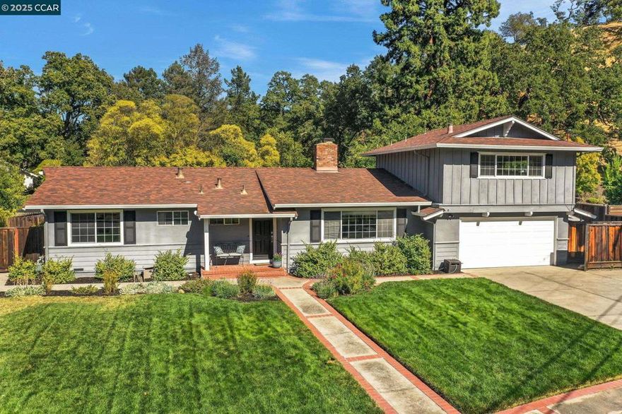 New Price! Spectacular sun-drenched property in Walnut Creek's picturesque Tice Valley tucked in an enclave of upscale homes with neighborhood vibrancy and connectivity! Enchanting setting, majestic backdrop of mature oaks & redwoods! Inviting brick porch, gleaming hardwoods, separate upstairs living space (perfect in-law setup with full bathroom + split unit). Awesome eat-in kitchen, East-facing for morning light, solid surface counters, subway tile backsplash, stainless steel appliances, 5 burner GE gas range, custom Cabinetry, newer Kitchen Aid stainless refrigerator, Frigidaire oven, breakfast bar, and sunny breakfast nook. Spacious family room looking out to the backyard deck, dual pane windows, fresh paint, two peaceful primary suites, rich tile finishes, floor warmer, traditional fireplace with used brick hearth & gas starter, designer lighting with seeded glass fixtures, classic subway brick tile & slate-hued floor tiles. Stunning and private park-like backyard, a tranquil entertainers paradise, with sparkling pool and spa multiple patios, vegetable garden area, trellis arbor, chicken coop basketball area, lush level lawns, mature trees, and colorful gardens. Colorful gardens with Japanese maple, hydrangeas! Ample room for ADU and/or addition, side-yard access for boat!