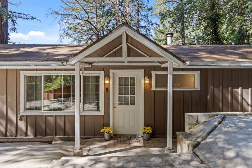 Discover the charm of Boulder Creek living in this 2-bedroom, 1-bathroom home offering 1,108 sq ft of space on a 3,790 sq ft lot. With thoughtful details throughout, it blends rustic character with modern convenience. Enjoy vaulted and open beam ceilings that add volume and style. The kitchen features solid surface Corian countertops, electric oven range, dishwasher, and refrigerator, functional and attractive. Laminate and tile flooring create a smooth flow, while a wood stove, wall furnace, and fireplace keep the space warm and inviting. A laundry area with washer/dryer hookups adds convenience. A bonus basement provides valuable additional space perfect for storage, projects, or a home office. Other features include energy-efficient appliances, double-pane windows, and an outdoor shed. Located in the San Lorenzo Valley Unified School District, with easy access to local resources. This home offers peaceful surroundings, flexible space, and modern comfort, come experience Boulder Creek.