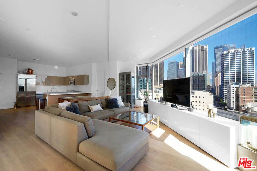 Luxury Sky Lofts high-rise loft with private bedrooms, North East Corner views overlooking beautiful Downtown skyline.  Each bedroom bring breathtaking views and a full bathroom (primary has two sink basins, separate bathtub and shower) and walk-in closet.  Secure, enclosed two parking spaces connected to the building.  Upgraded engineered hardwood floors, 10 foot high finished ceilings, solid core / STC rated doors.  Large gourmet kitchen with high quality appliances - gas range, Caesar stone counters, and sleek Italian cabinets.  Washer and dryer in unit.  Building amenities include 24 hour security, lounge, fitness center, and screening room.  Walking distance to Whole Foods, Ralphs, Fig & 7th, Target, the Bloc, LA Live - Staples center, FIDM, and many restaurants/entertainment.
