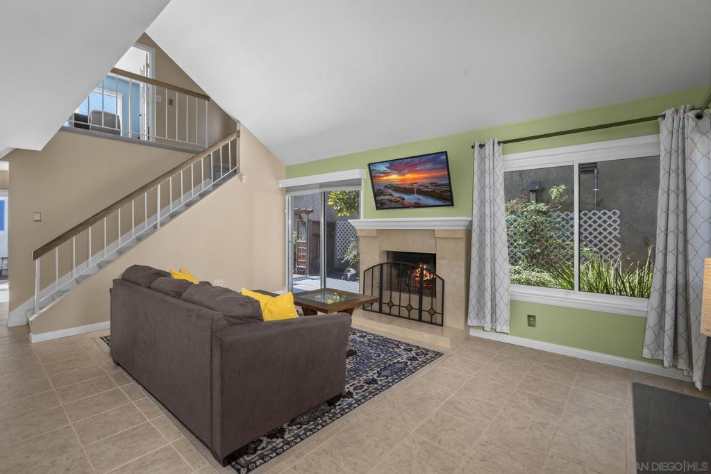 Soaring vaulted ceilings and a cozy fireplace set the tone in this light-filled 4BR/2.5BA Villa Portofino home. A remodeled kitchen with premium appliances and granite counters connects to the dining area, creating a warm, functional hub for gatherings. The private yard and patio extend your lifestyle outdoors, while the spacious primary suite with custom closet and ensuite bath offers a true retreat. Enjoy resort-style community amenities—pool, spa, tennis, playgrounds, and walking paths—plus solar, EV readiness, an upgraded 2-car garage, and top-rated schools nearby. Set within Tierrasanta’s highly desirable Villa Portofino community, this 4-bedroom, 2.5-bath residence offers the perfect balance of modern upgrades, timeless comfort, and a strong sense of community. Step inside to soaring vaulted ceilings that flood the living room with natural light, anchored by a cozy fireplace that instantly makes the space feel like home. Just beyond, a thoughtfully remodeled kitchen with premium stainless steel appliances, granite counters, and rich cabinetry connects seamlessly to the dining area, creating a warm and functional hub for everyday living and entertaining. The spacious primary suite features an ensuite bath and a custom built-in closet system, while three additional bedrooms provide flexibility for family, guests, or a home office. A dedicated laundry room adds everyday convenience, and an upgraded enclosed 2-car garage with abundant storage plus an extra parking space ensures practicality at every turn. Outside, enjoy your own private yard and patio—a rare feature in Villa Portofino—giving you the freedom to garden, entertain, or create your personal retreat. Beyond your front door, the HOA-maintained community offers resort-style amenities including a pool, spa, tennis courts, playgrounds, lush greenbelts, and beautifully landscaped walking paths. Sustainability and efficiency come standard with a solar panel system and EV readiness, keeping modern living both cost-effective and environmentally conscious. And with Tierrasanta’s reputation for an excellent school district and top-rated campuses nearby, this home checks every box for family-friendly living. Known as “the island in the hills”, Tierrasanta offers a unique lifestyle: tucked away for peace and quiet, yet just 20 minutes from Downtown San Diego. With Mission Trails Regional Park at your doorstep, you’ll have endless options for hiking and outdoor adventure, while nearby grocery stores, cafés, restaurants, and shops ensure daily convenience. 10748 Escobar Drive isn’t just a home—it’s an invitation to experience comfort, community, and the San Diego lifestyle at its best.