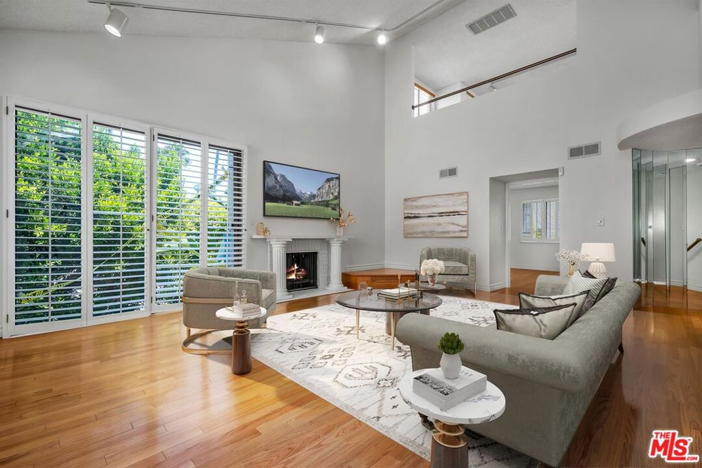 This spacious light filled front facing TH is minutes away from restaurants and shopping on Montana Ave, as well as perfect for catching the sunset along Palisades Park overlooking the Pacific Ocean. The kitchen with stainless steel appliances overlooks the formal dining room on the first floor. The bedroom or den on the first floor opens through french doors to a large patio. The living room on the second floor features high ceilings and fireplace, adjacent to the primary bedroom suite. The 3rd floor bedroom is an ideal at home work space. The laundry is located in the large direct entry private garage. There are wood floors and plantation shutters. Some photos are virtually staged.